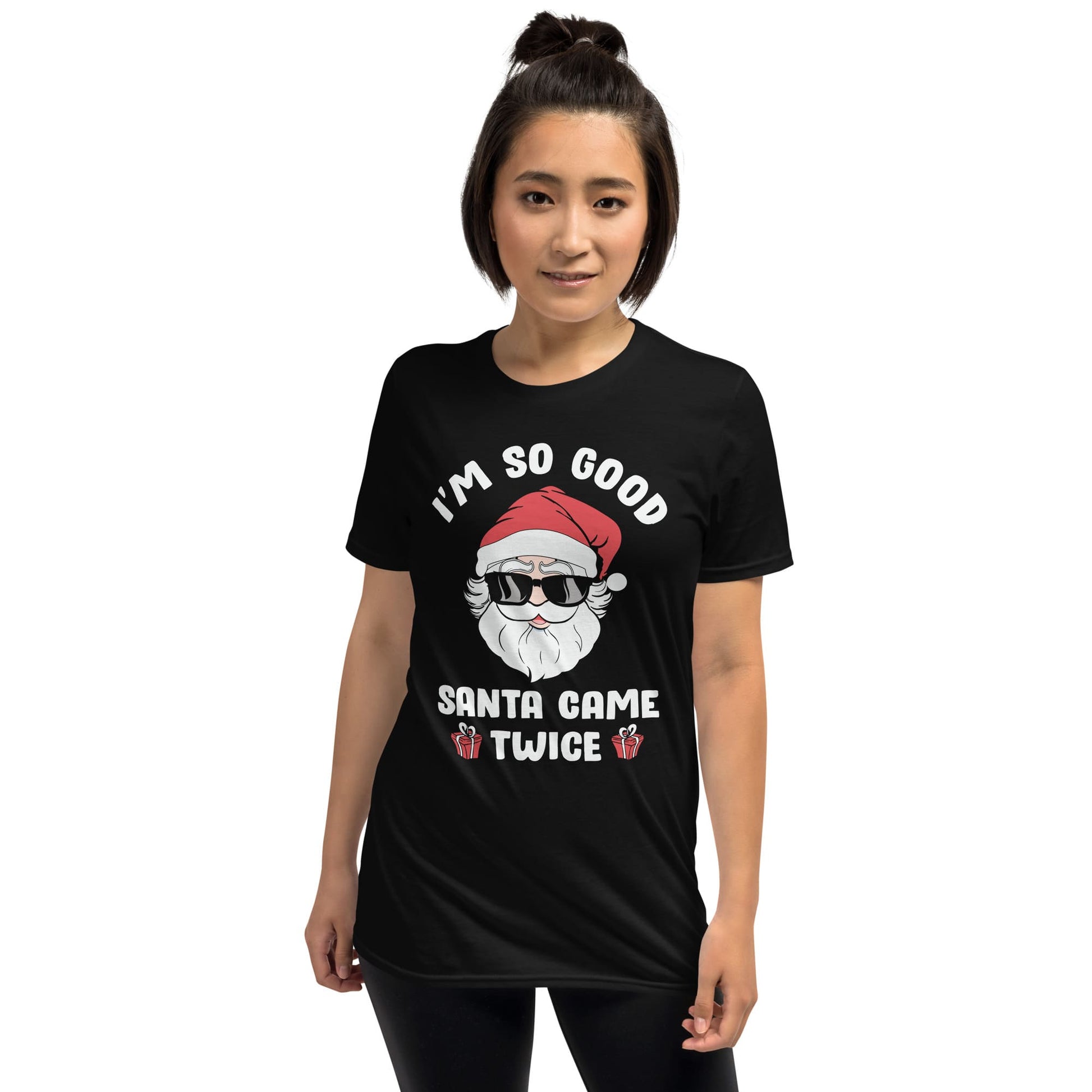 Person wearing a black t-shirt with a humorous Christmas design on a white background