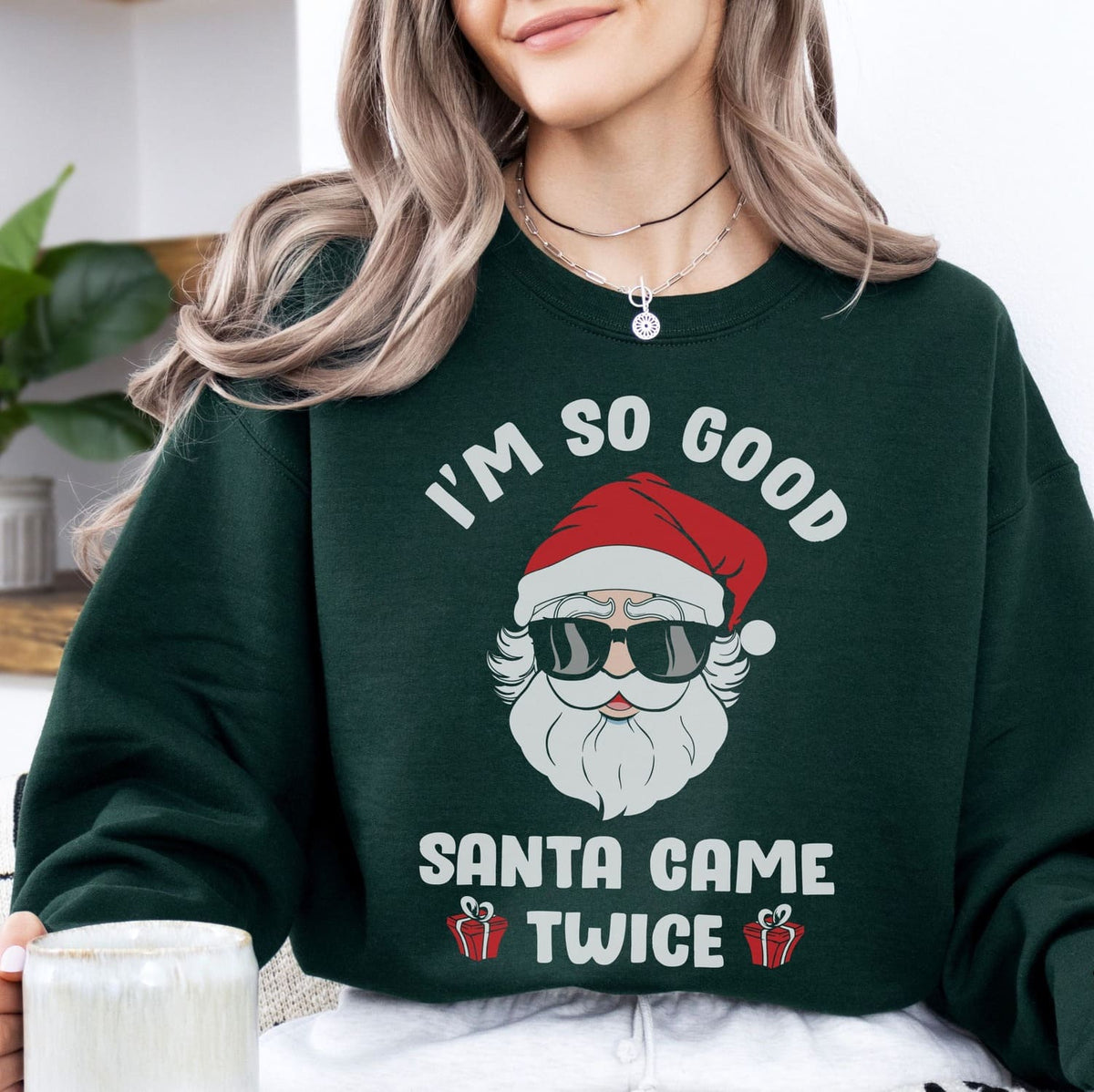 woman wearing naughty santa christmas sweatshirt