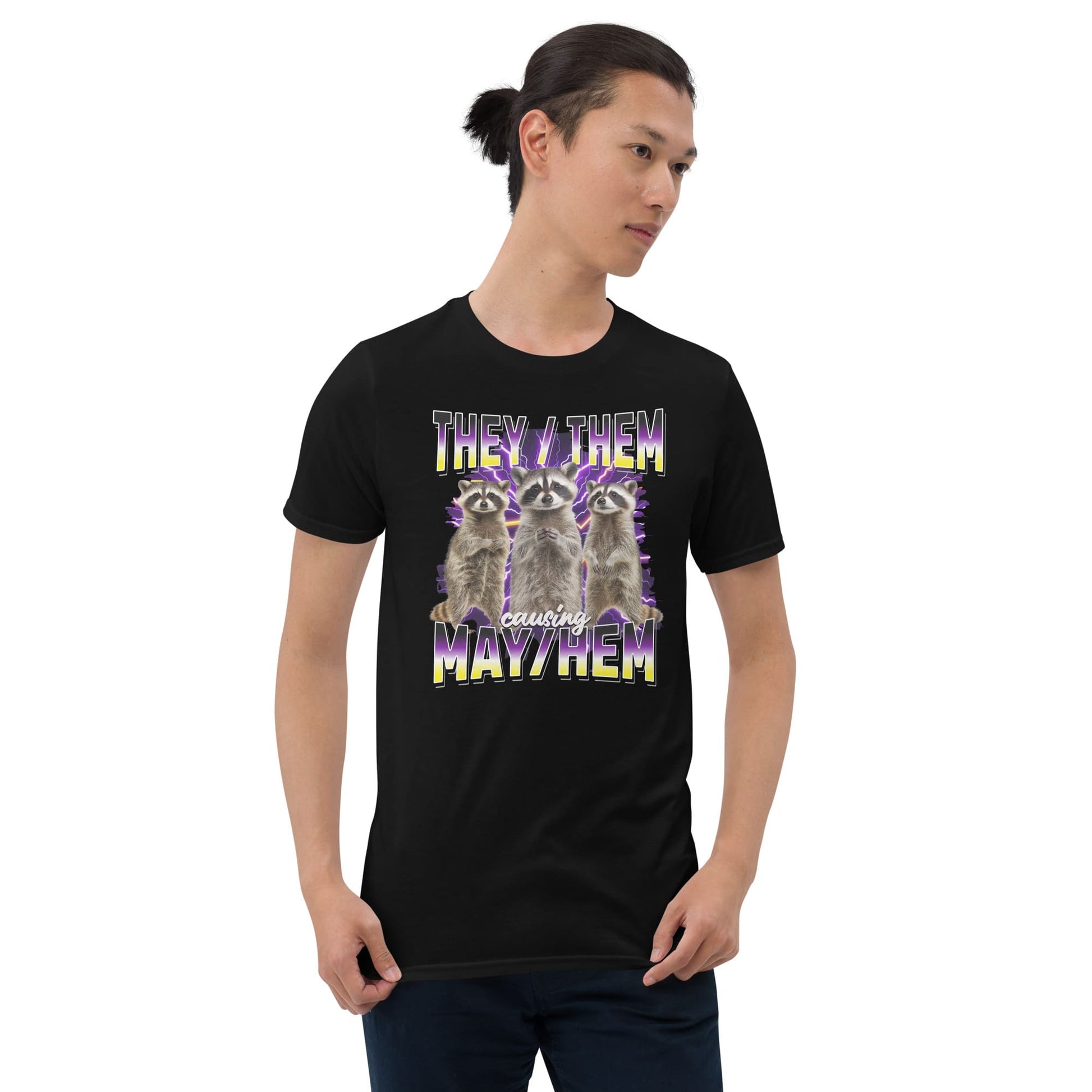 Person wearing a black nonbinary bootleg t-shirt with a graphic of two raccoons and they them pronouns