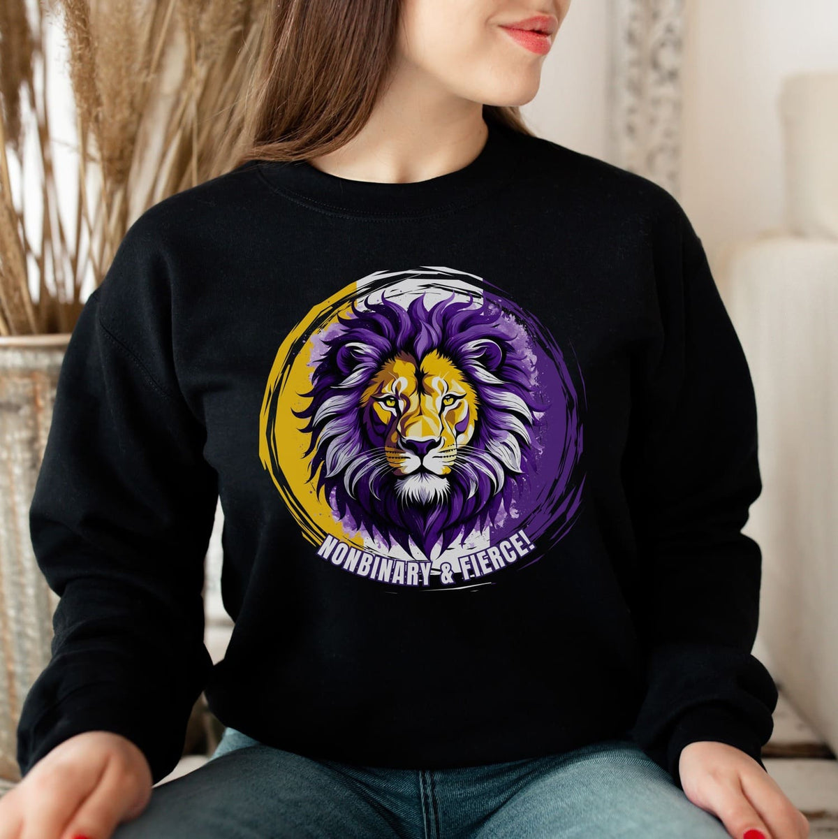 person wearing nonbinary lion sweatshirt