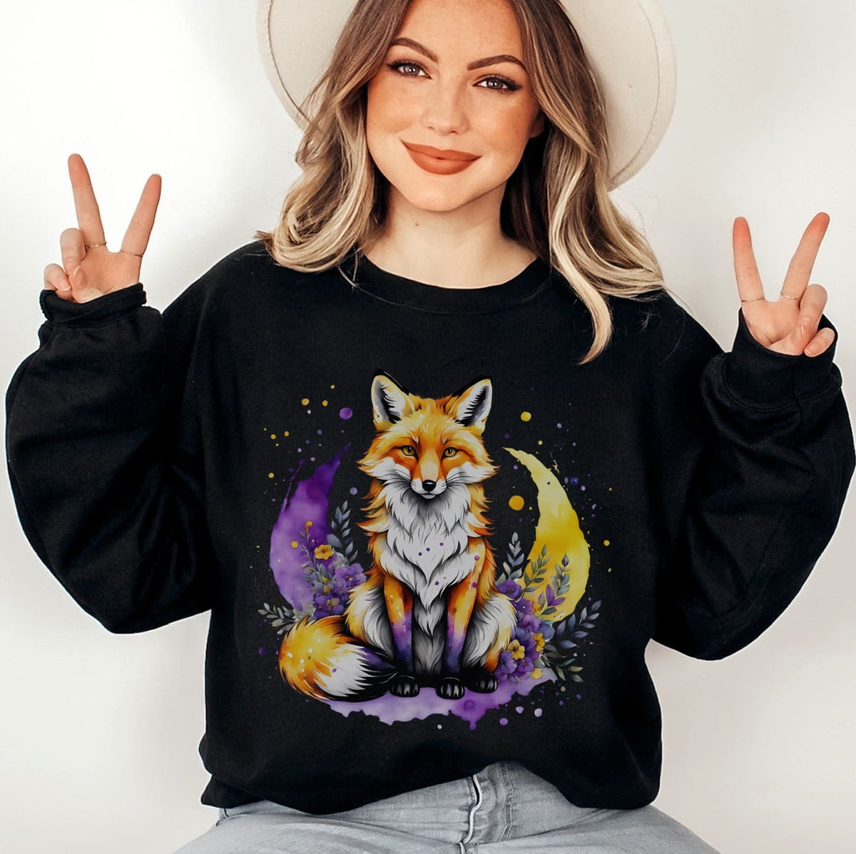 person wearing black sweatshirt with cute fox in nonbinary colors