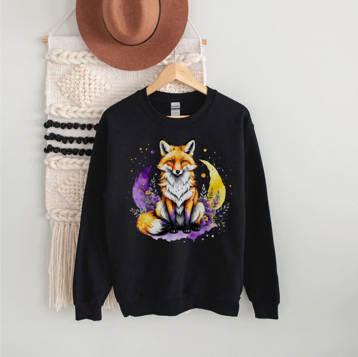 black sweatshirt with cute fox in nonbinary colors hanging