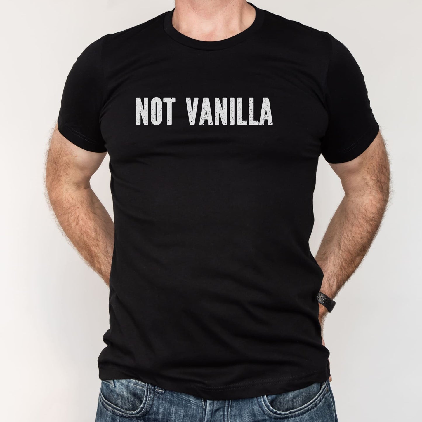 Black t-shirt with 'NOT VANILLA' text worn by a person on a white background
