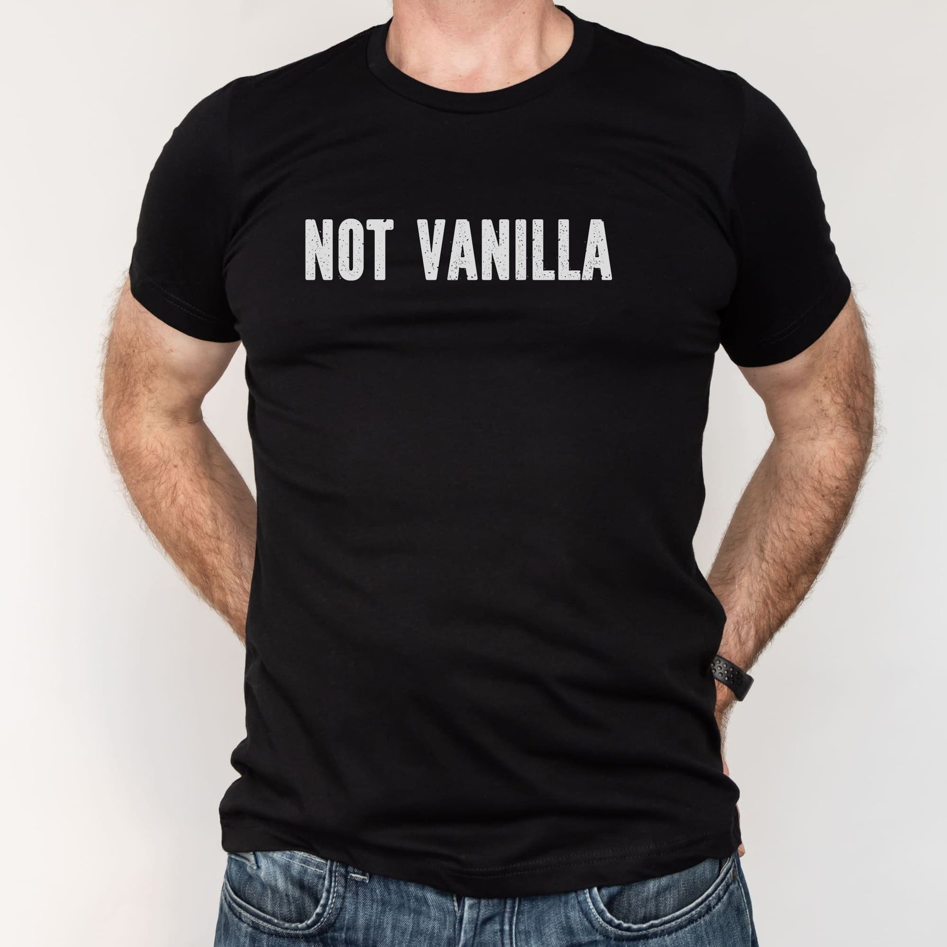 Black t-shirt with 'NOT VANILLA' text worn by a person on a white background