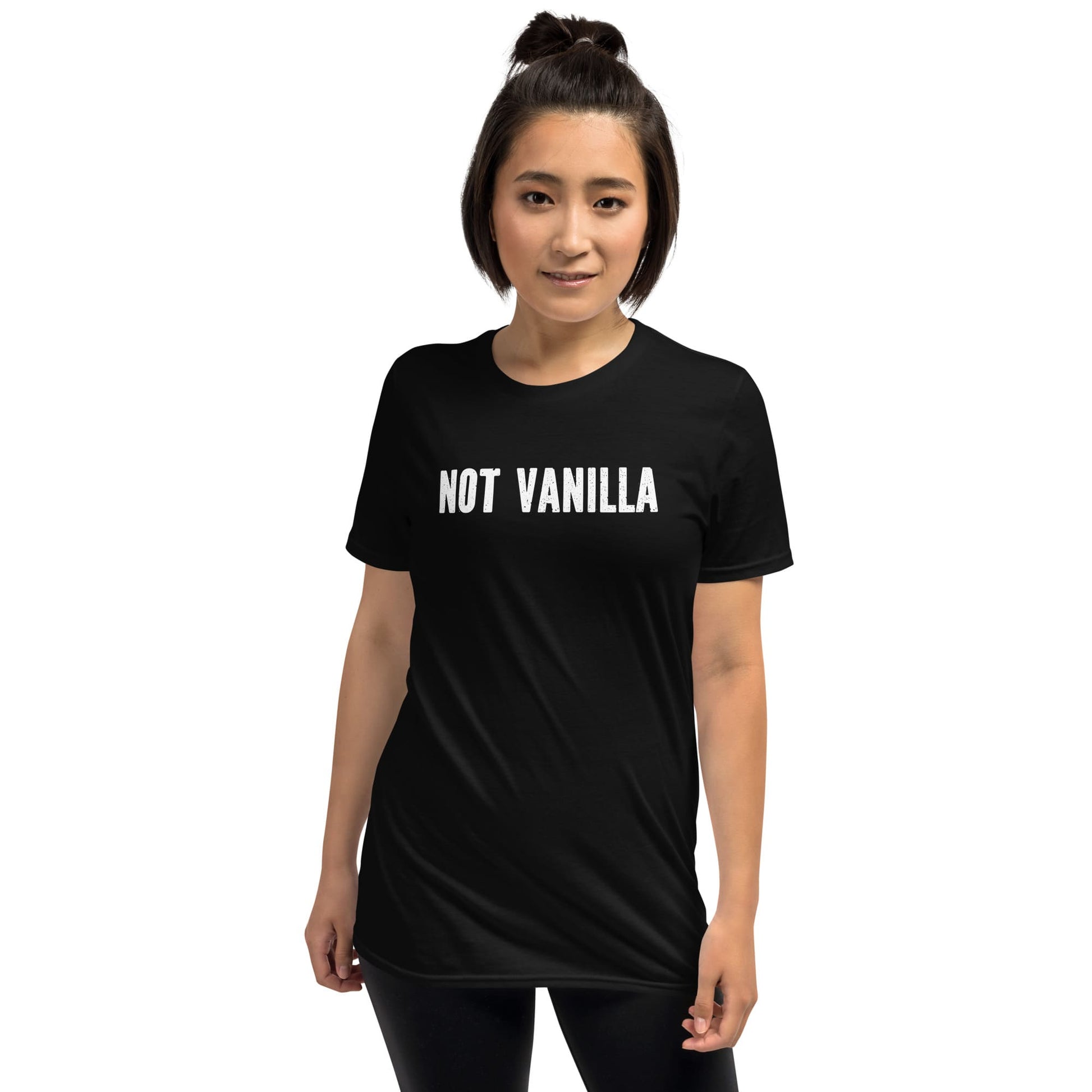 Person wearing a black t-shirt with 'NOT VANILLA' text on a white background