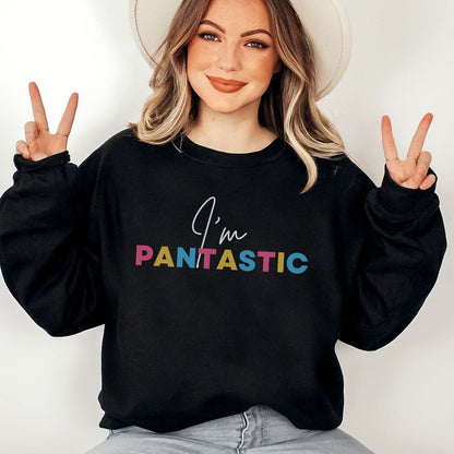Person wearing a black pansexual sweatshirt with 'I'm PANTASTIC' text, making peace signs.