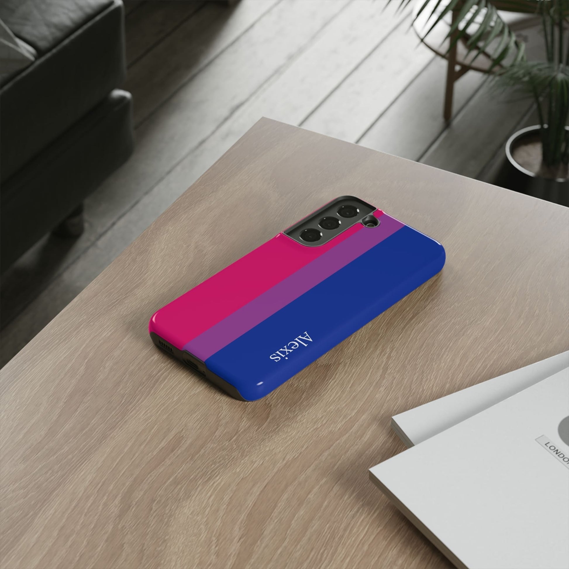 bisexual flag phone case, on table