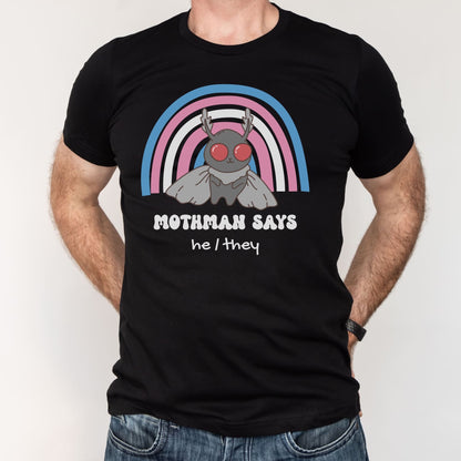 Black t-shirt with Mothman graphic and rainbow arch, worn by a person on a white background: Personalized Trans Mothman Shirt, Custom Pronouns Transgender Pride Cryptid Tee, Folklore Mythology TShirt, Queer Cryptozoology FTM FTM Gift