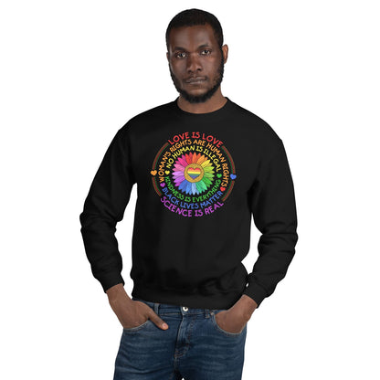Person wearing a black pride sweatshirt with a colorful design and text on a white background