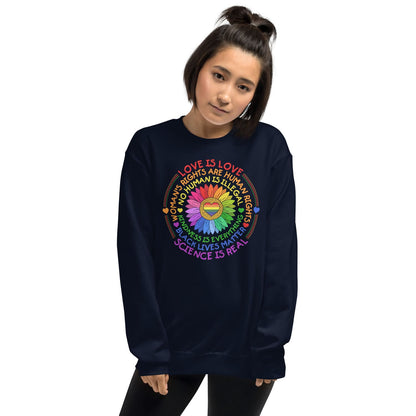 Person wearing a navy pride sweatshirt with colorful text and symbols on a white background