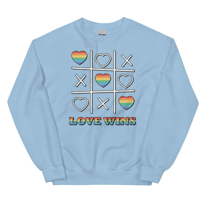 Light blue LGBT pride sweatshirt with a graphic of a tic-tac-toe game featuring rainbow hearts and the text 'Love Wins' on a white background.