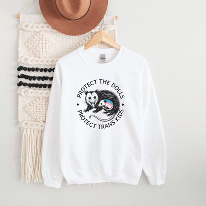 White 'protect trans kids' sweatshirt with a graphic design and text on a white background