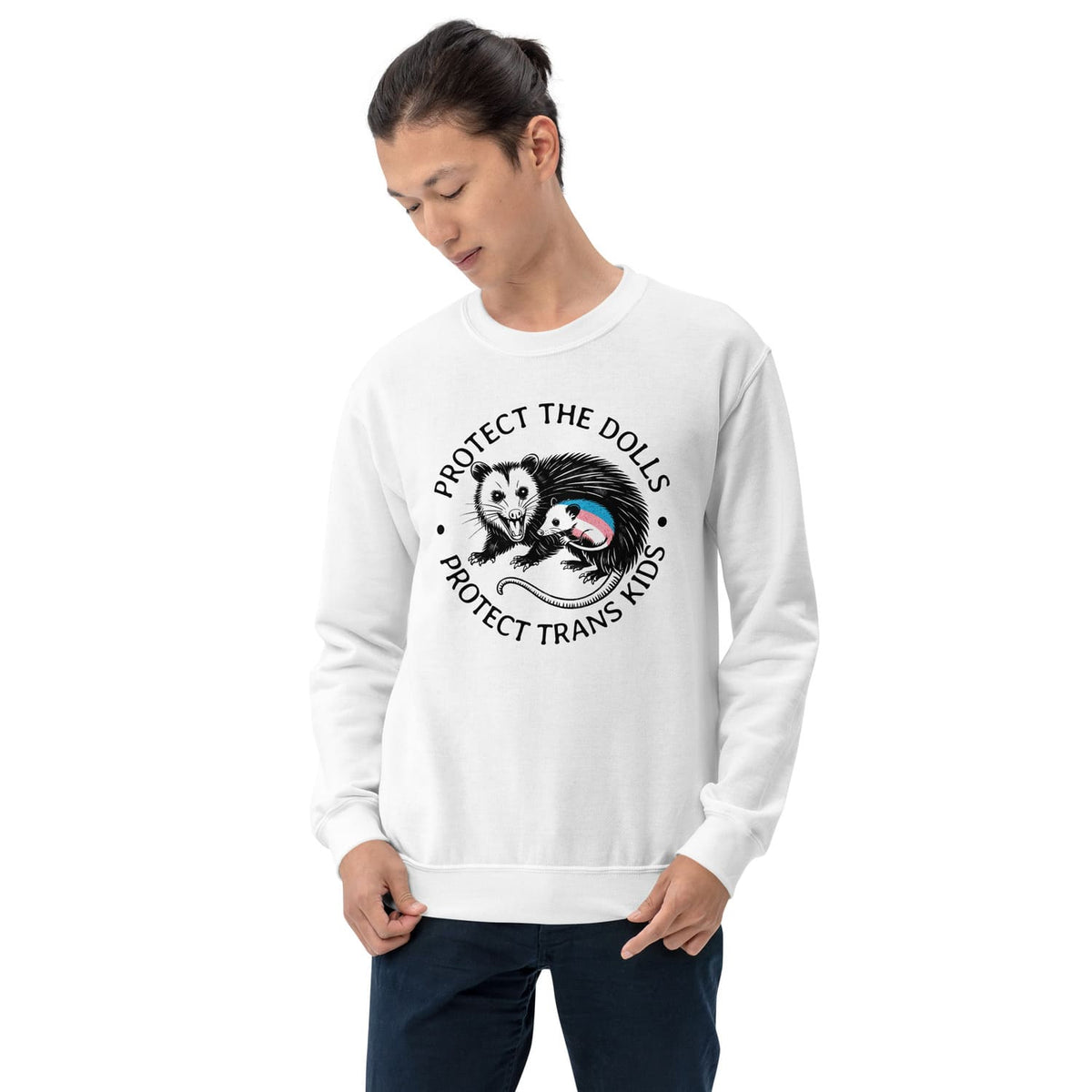 Person wearing a white 'protect trans kids' sweatshirt with a graphic design and text on a white background