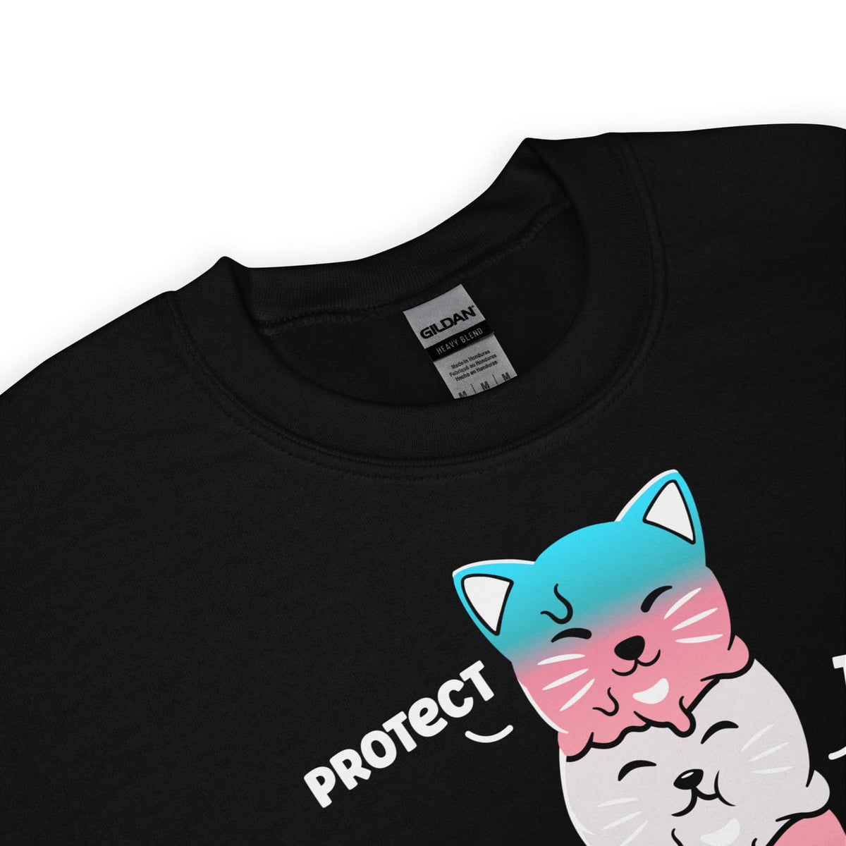 Detail of transgender sweatshirt with a cute cat graphic and 'PROTECT trans kids' text on a white background