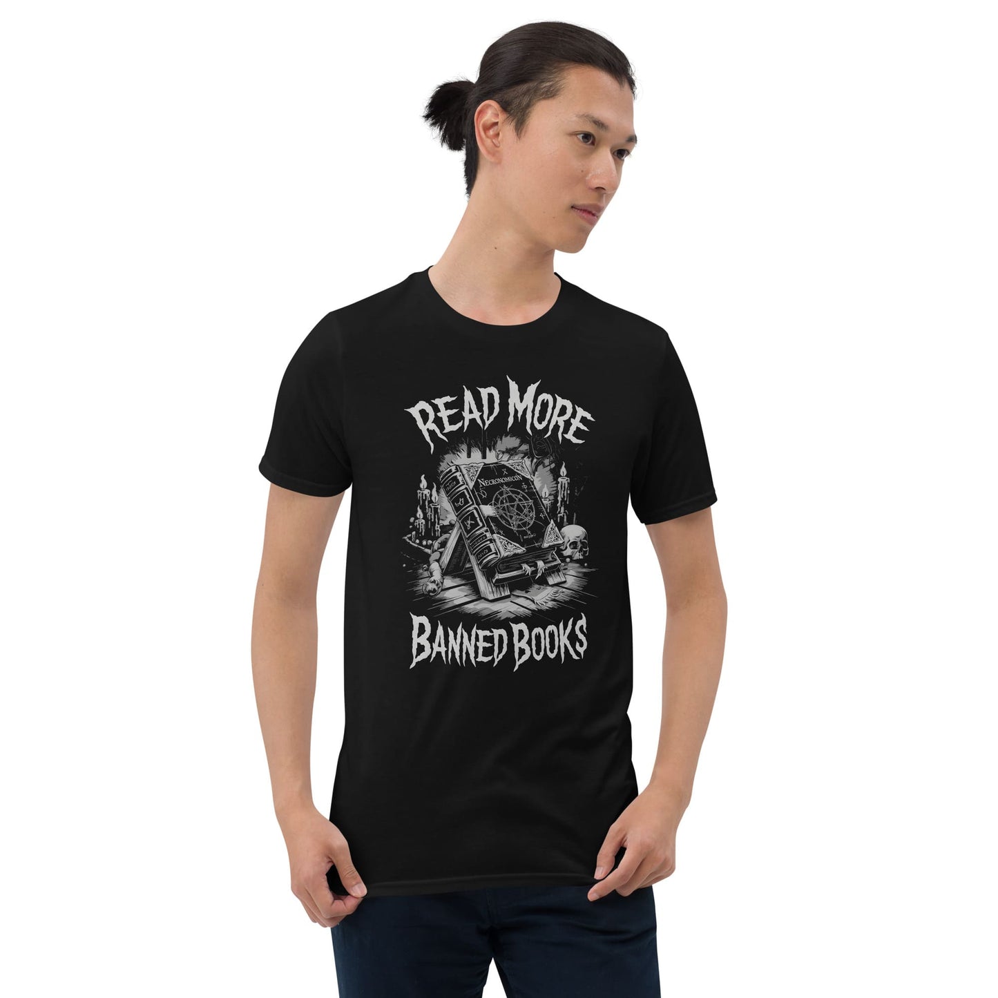Person wearing a black t-shirt with 'Read More Banned Books' Necronomicon design on a white background