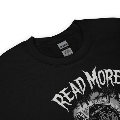 Black sweatshirt with 'Read More banned books' graphic design on a white background