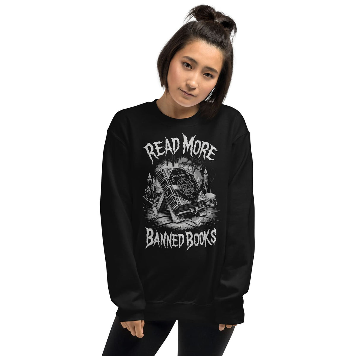 Person wearing a black sweatshirt with 'Read More Banned Books' graphic design on a white background