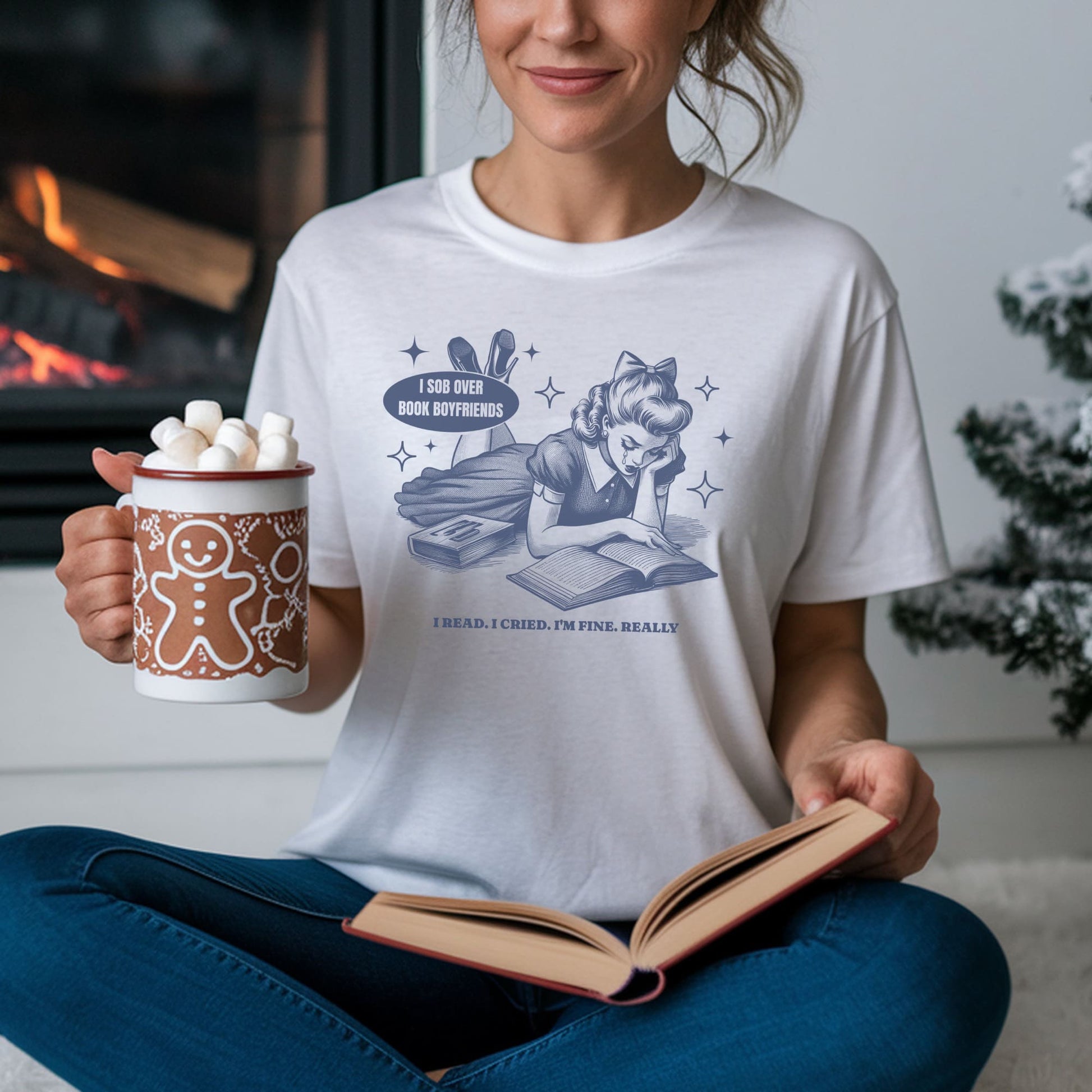 Person wearing a white t-shirt with a graphic design, holding a mug and a book in a cozy indoor setting: Funny Bookish Comfort Colors Shirt, Retro Book Lover Tee, Sarcastic Reading T-Shirt, Subtle Mental Health Awareness Gift For Book Lover