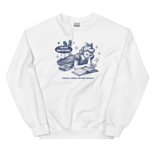 White sweatshirt with graphic design of a girl reading a book and text on a white background