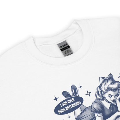 White bookish sweatshirt with graphic design and text on a white background