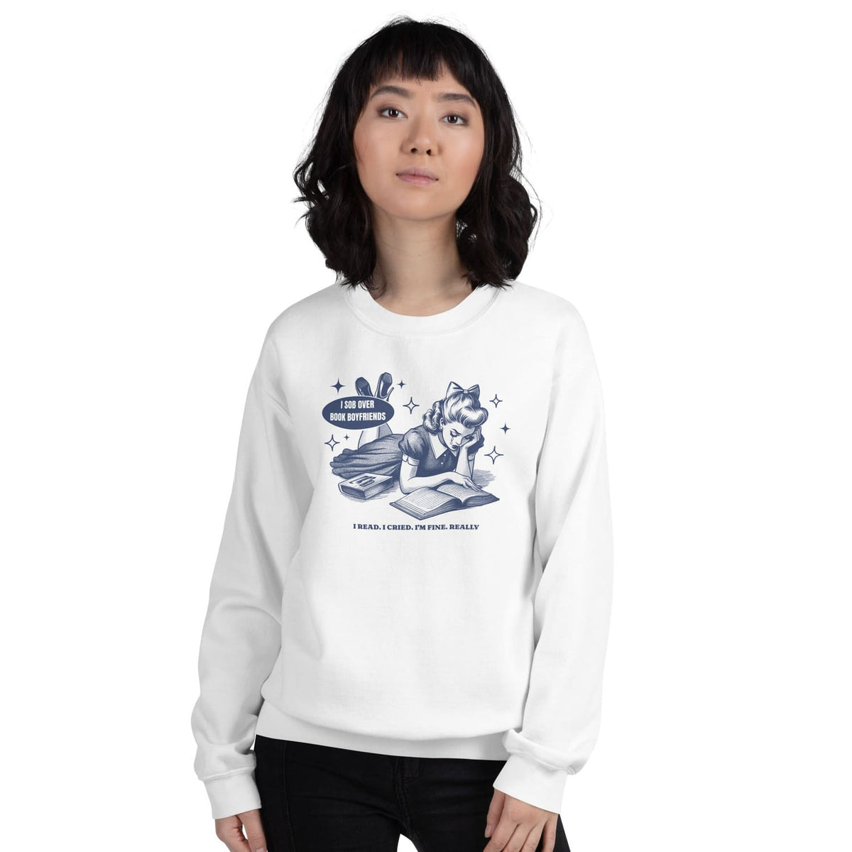 Person wearing a white sweatshirt with a bookish graphic design on a white background