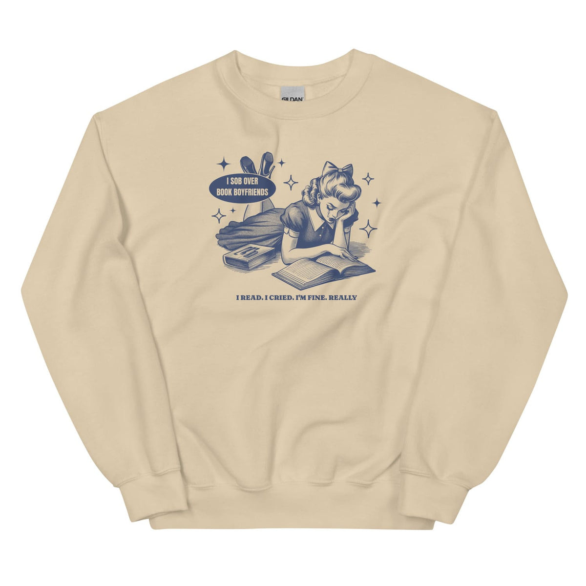 Beige sweatshirt with graphic design of a girl reading a book and text on a white background