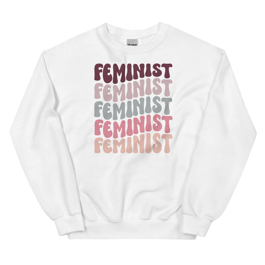 White sweatshirt with 'Feminist' text in various colors on a white background