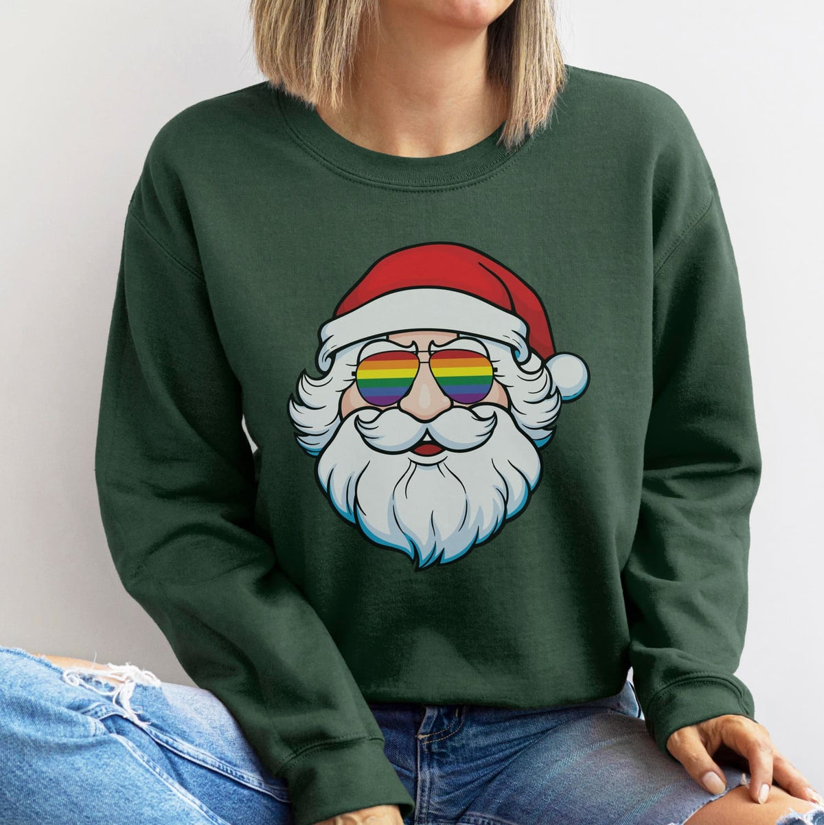 Person wearing a green sweatshirt with an lgbtq Santa Claus design.