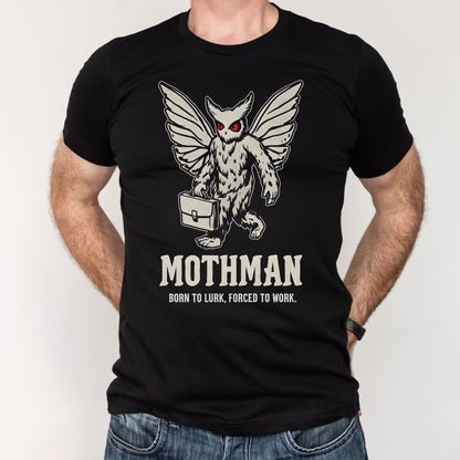 Black t-shirt with Mothman graphic and text worn by a person on a white background