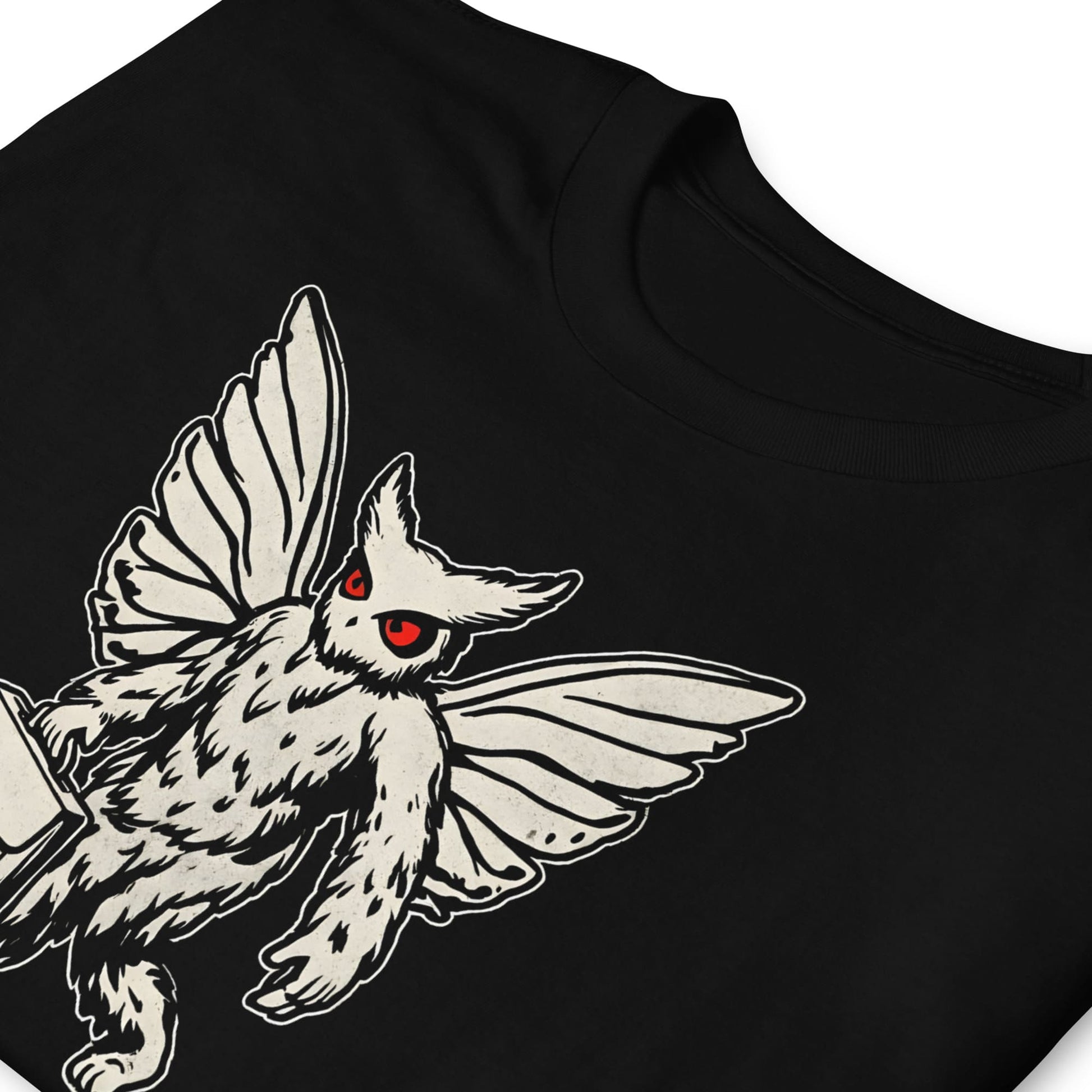 Black t-shirt with a white creature design featuring red eyes on a white background