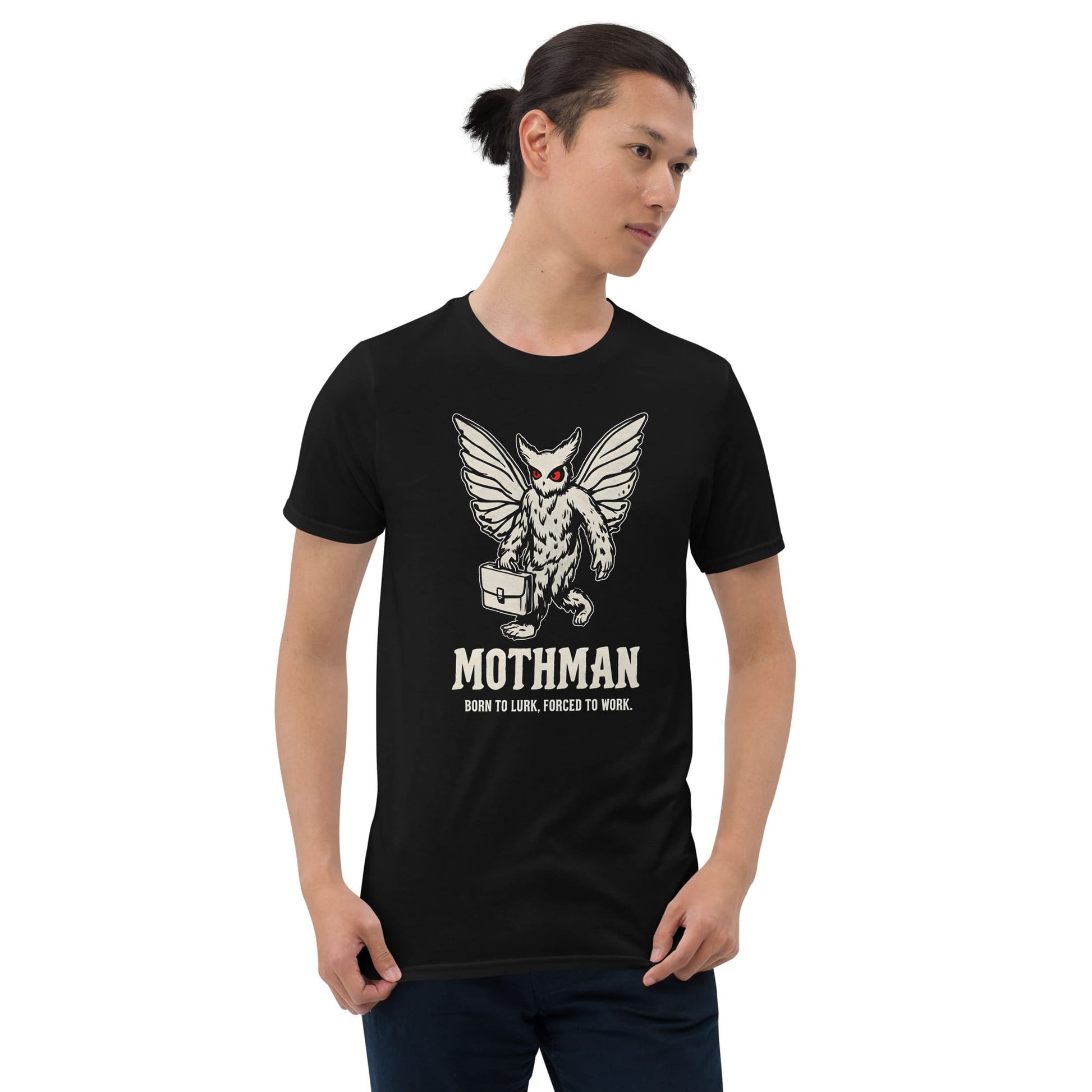 Person wearing a black t-shirt with Mothman graphic and text on a white background