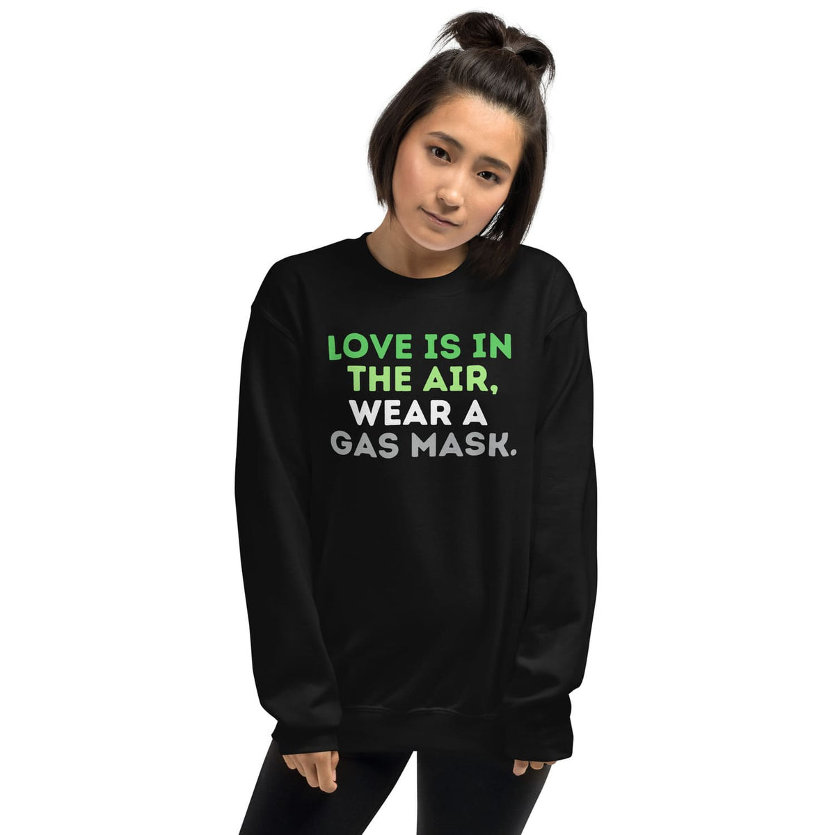 Person wearing a black aromantic sweatshirt with humorous text design on a white background