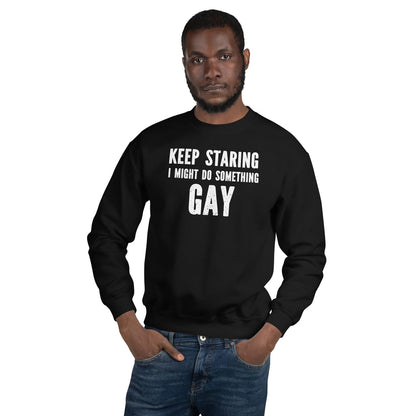 Person wearing a black gay sweatshirt with text on a white background