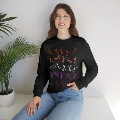 Woman wearing a subtle lesbian sweatshirt with sunset  scissors pattern sitting on a white surface.