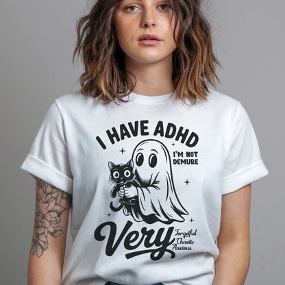 Person wearing a white t-shirt with a graphic design and text: Spooky ADHD Shirt, Funny Neurodiversity Halloween Tee, Neurospicy Gift For AuDHD, Mental Health Awareness Tshirt, Cute Neurodivergent Ghost