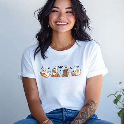Person wearing a white t-shirt with cartoon ghost designs on a plain background: Spooky Book Club Shirt, Ghost Bookish Halloween Tee, Fall Library T-Shirt, Reading Gift For Book Lover Or Teacher Cute Trick Or Treat Outfit