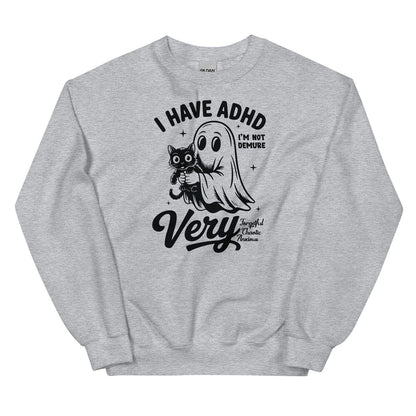 Gray sweatshirt with black graphic design featuring a ghost and cat, text 'I have ADHD I'm not demure Very Sweet and Chaotic Nerd', on a white background.