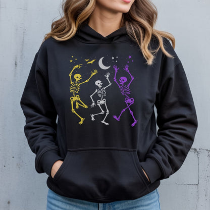 Person wearing a black hoodie with nonbinary skeleton designs on a gray background