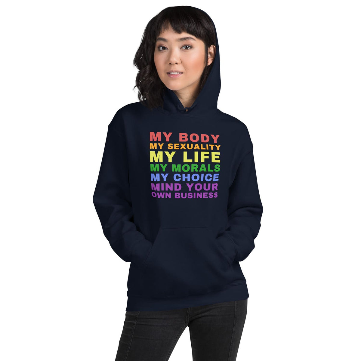 Person wearing a navy hoodie with colorful rainbow lgbt text on a white background