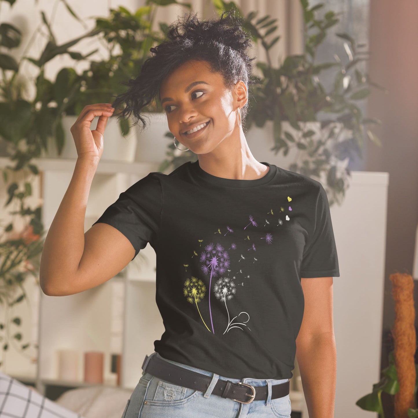 Woman wearing a black t-shirt with floral design in a home setting