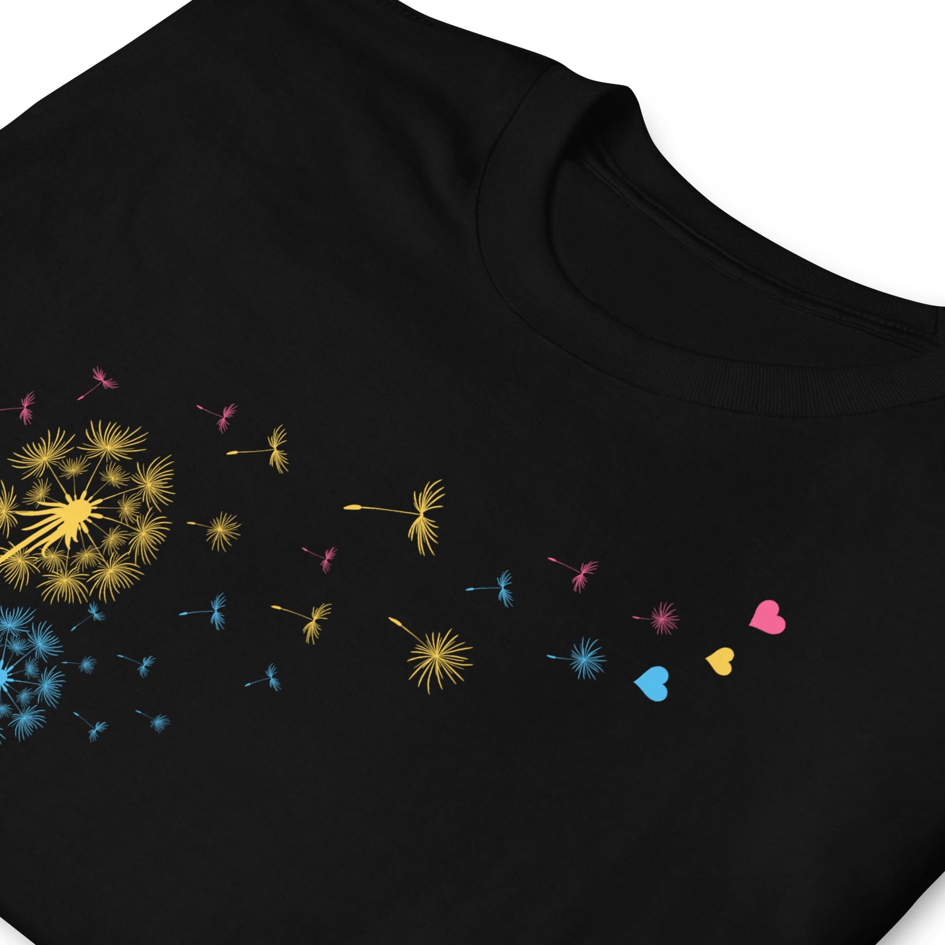 Black t-shirt with colorful dandelion seed designs on a white background