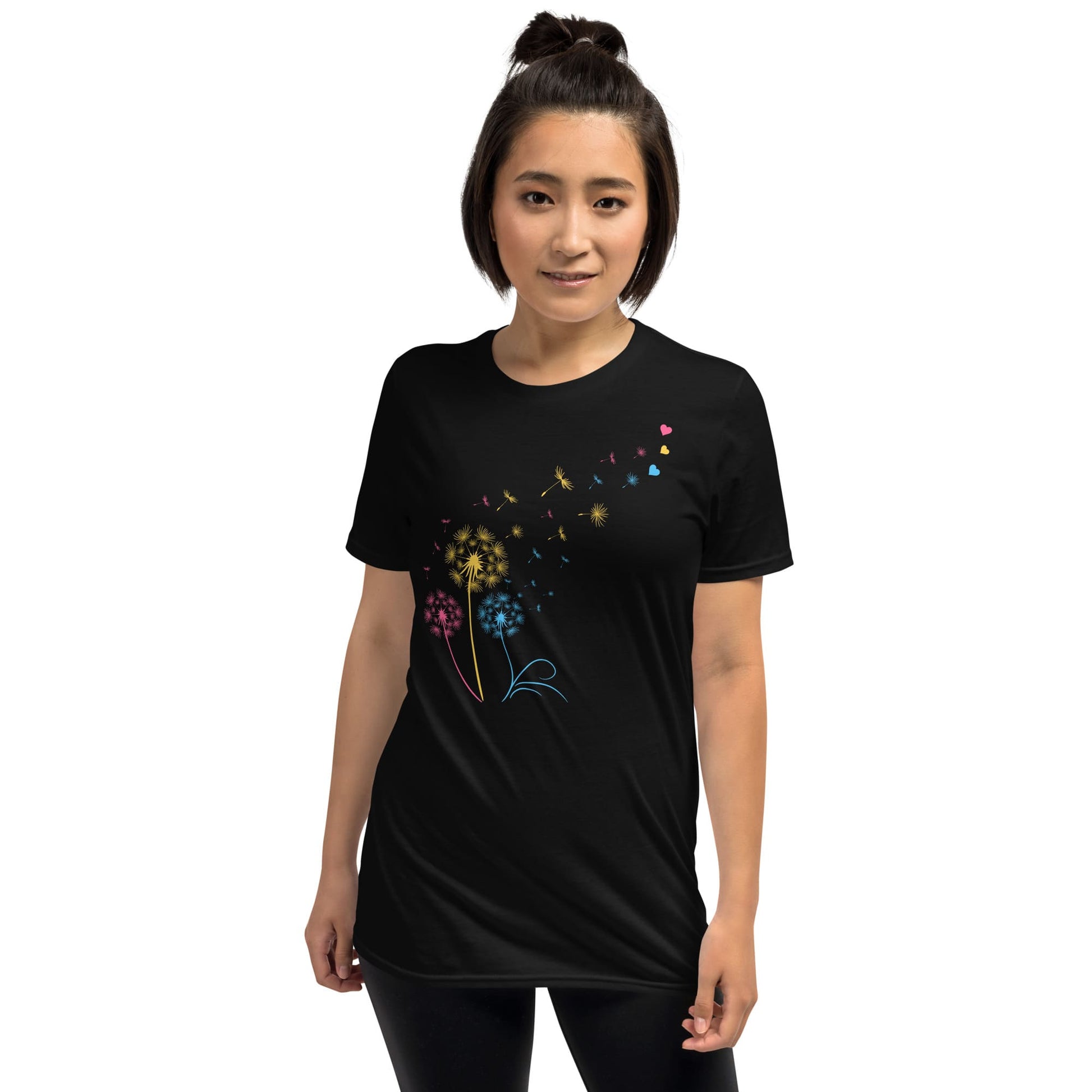 Person wearing a black t-shirt with colorful floral design on a white background