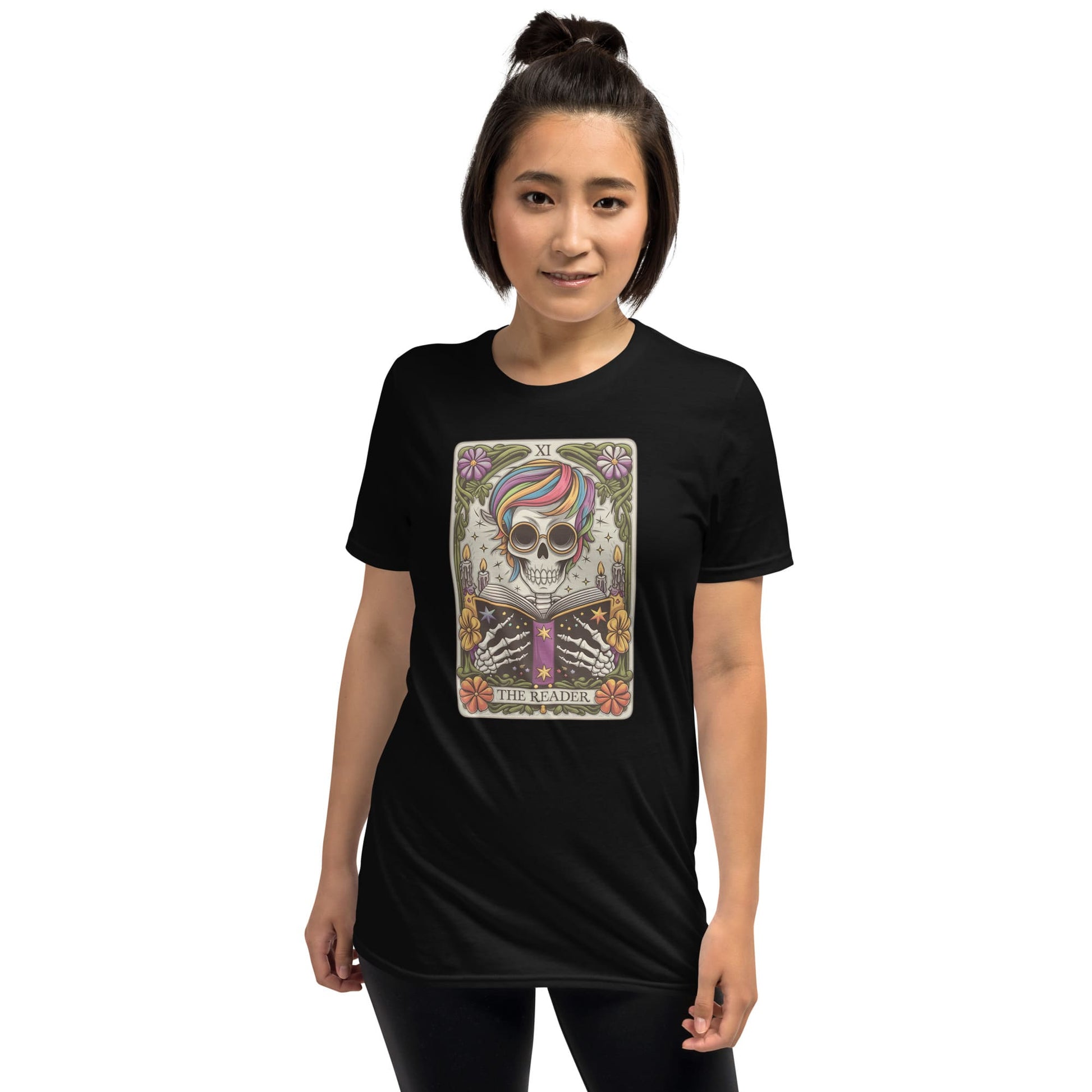 Person wearing a black t-shirt with a colorful graphic design on a white background: The Reader Skeleton Shirt, Tarot Card Bookish Halloween Tee, Subtle Pride Rainbow Seasonal T-Shirt, Mystical Gay Queer Spooky Reading Gift