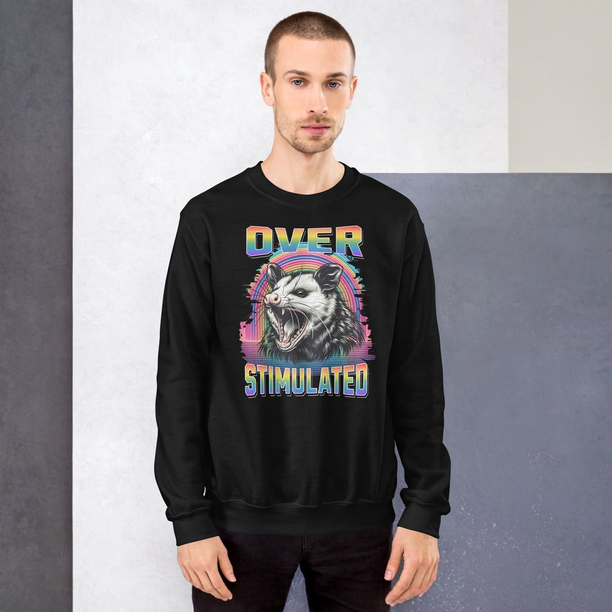 Person wearing a black neurodivergent lgbtq pride sweatshirt with a colorful graphic design and text.