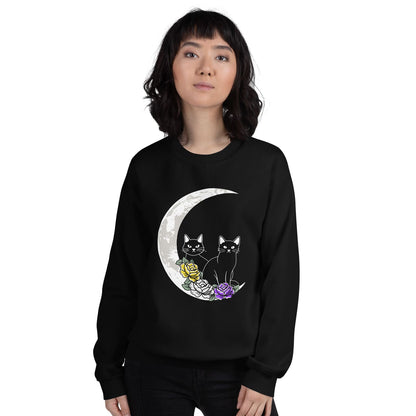 Person wearing a discreet nonbinary sweatshirt with a moon and cat design on a white background
