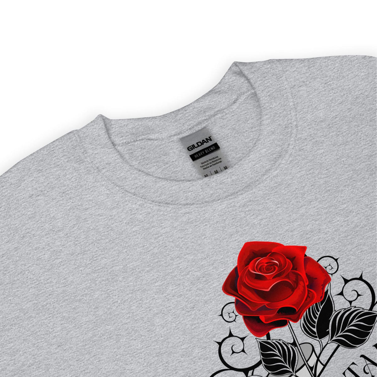 Detail of enby pride sweatshirt with a red rose and black leaves design on a white background