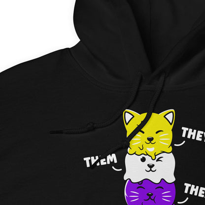 Black kawaii nonbinary they them pronouns hoodie with cartoon cat designs on a white background