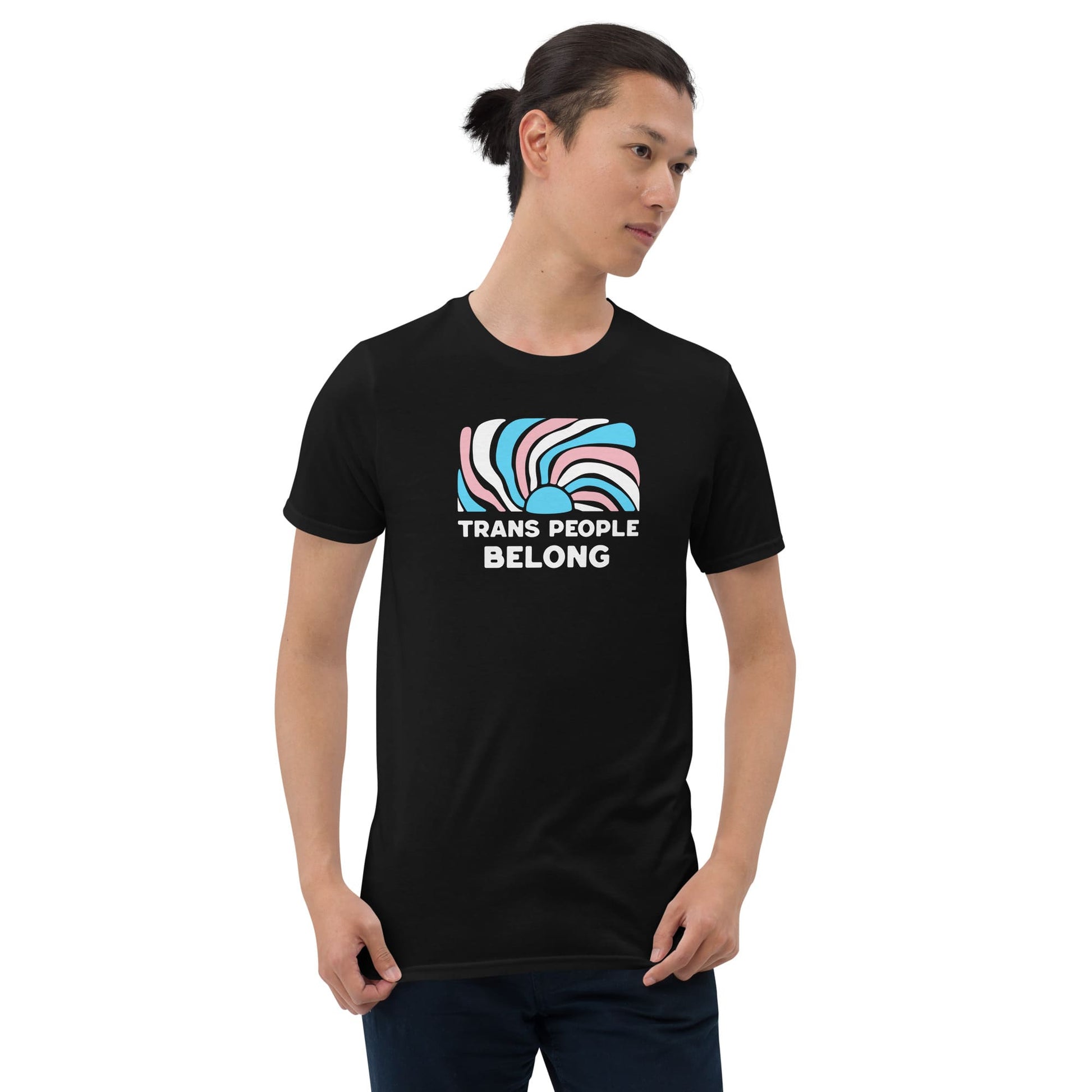 Person wearing a black t-shirt with 'Trans People Belong' text and modern design on a white background