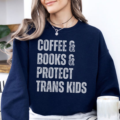 Person wearing a navy blue sweatshirt with text 'COFFEE & BOOKS & PROTECT TRANS KIDS' in a casual setting.