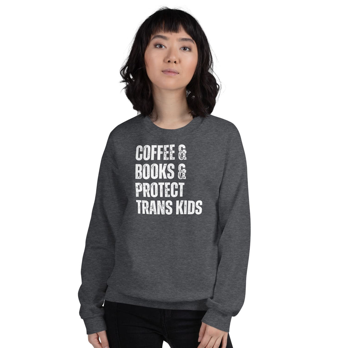 Person wearing a dark gray coffee bookish trans rights sweatshirt with text on a white background